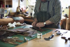 florentine leather: Male worker in leather workshop