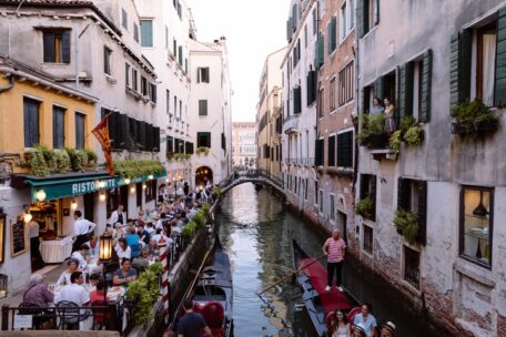 Panoramic view of Venice canal with historical buildings and gondolas