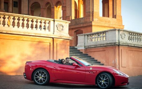 tourists in a ferrari car