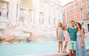family visiting the trevi fountain in Rome